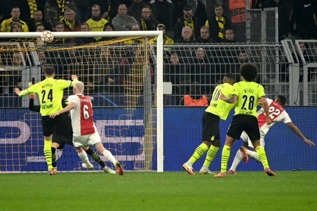 Ajax reach last 16 as Dortmund fume over Hummels red