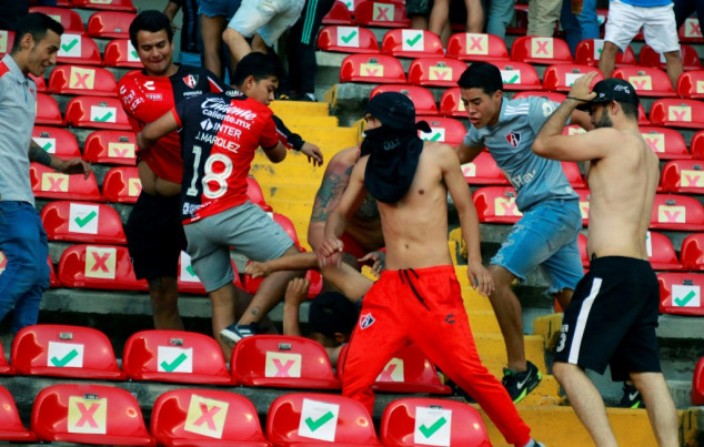 Mexico football match suspended after violence breaks out in stands