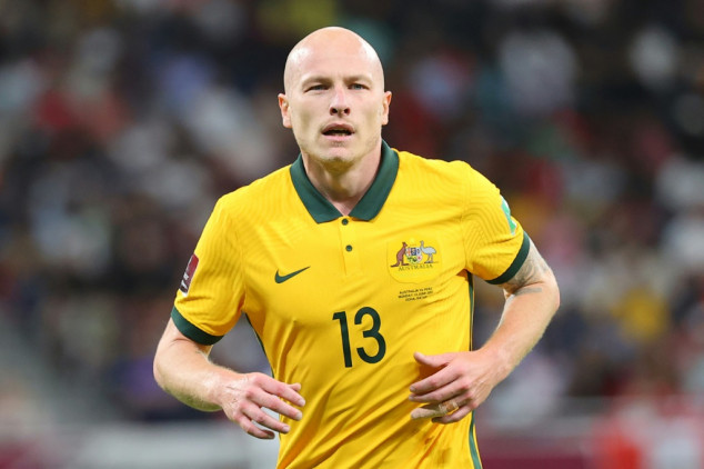 Scottish champions Celtic signed Australia midfielder Aaron Mooy on a free transfer and German defender Moritz Jenz on loan from Lorient on Tuesday.